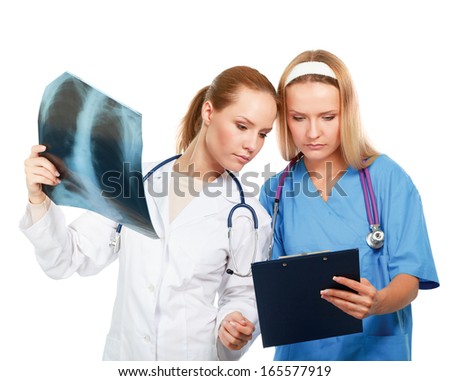 Portrait of two successful female doctors holding a writing pad and x-ray