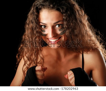 Portrait of young beautiful fitness woman, isolated on black background