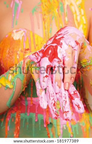 A half of body painted with many vivid colors