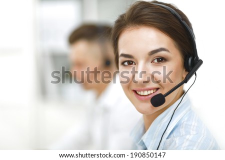 Attractive young people working in a call center