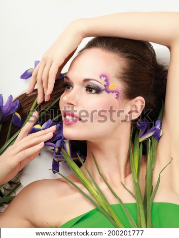 Beautiful woman with flower iris, isolated on white background