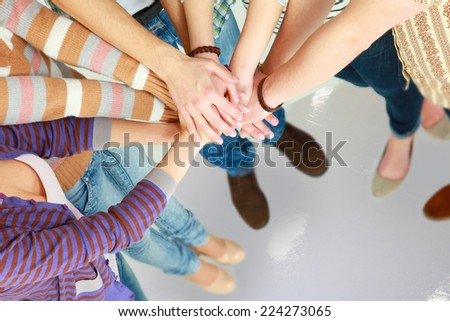 Pile of hands of friends.