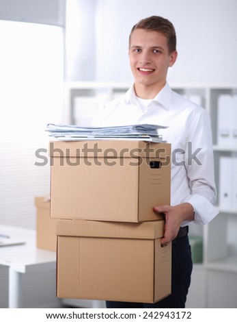 Portrait of a person with moving box and other stuff isolated on white