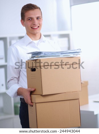 Portrait of a person with moving box and other stuff isolated on white