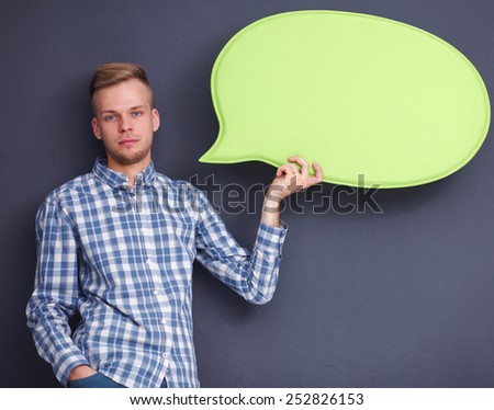 Man holding white blank speech bubble with space for text,