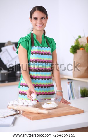 Woman is making cakes in the kitchen