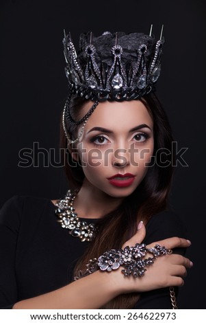 Portrait of woman in black crown
