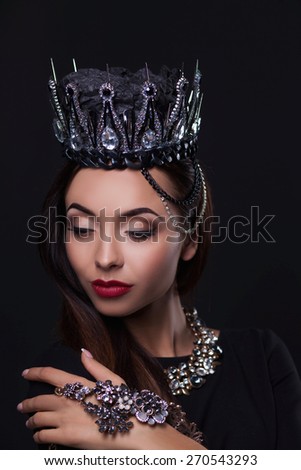 Portrait of woman in black crown