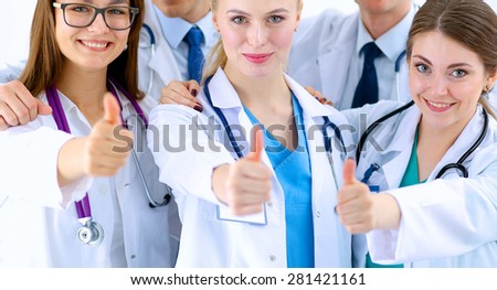 Portrait of doctors team showing thumbs up