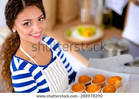 Woman is making cakes in the kitchen