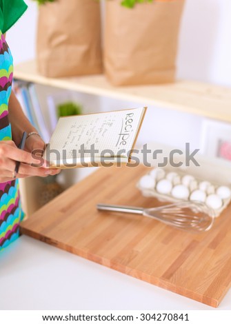 Woman is making cakes in the kitchen