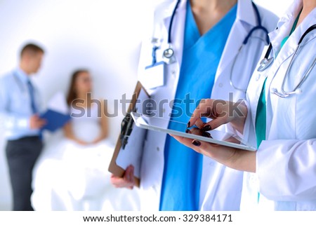 Young woman  doctor holding a tablet pc