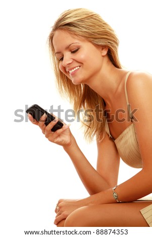 Beautiful caucasian woman looking at cell phone in hand against white background