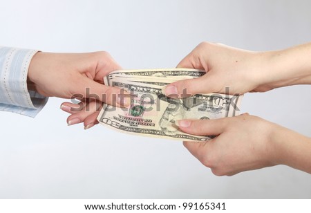 Hand handing over money