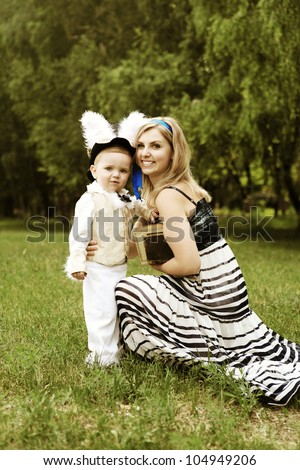 Happy young woman and little boy like characters of tale \