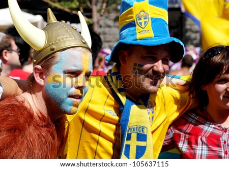 KYIV, UKRAINE - JUNE 19 2012:  Sweden football fans before start match Sweden - France, Group D.  Official fan zone on Khreshatyk street.  EURO 2012 in Kyiv, 19 june 2012