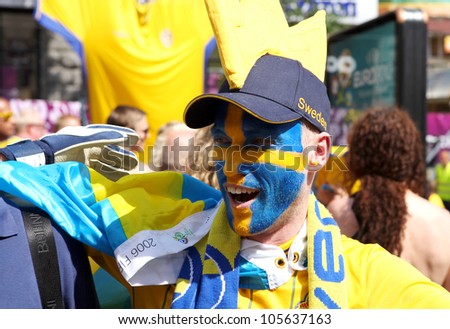 KYIV, UKRAINE - JUNE 19 2012: Official fan zone. Sweden football fan before start match Sweden - France, Group D. EURO 2012 in Kyiv, 19 june 2012