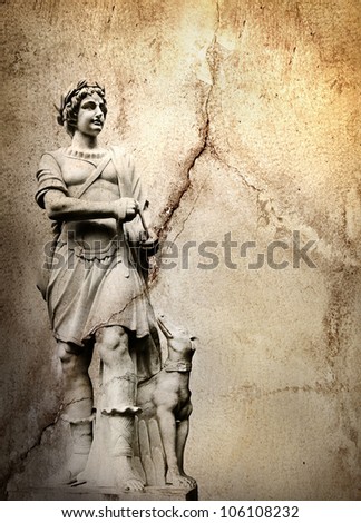 Old stone background with a sculpture man with dog