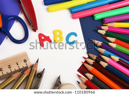 Background with school stationery and alphabet letters ABC