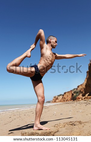 Yoga practice. Man doing yoga pose king of dances