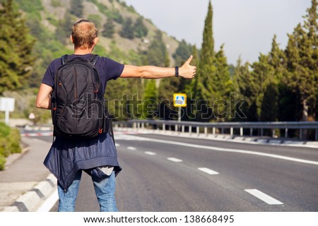Hitchhiking Travel Man At The Route