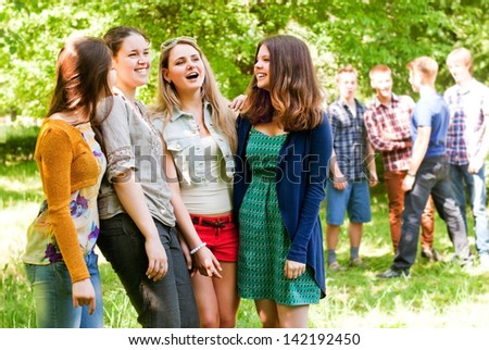 Group Flirting Young People In The Park