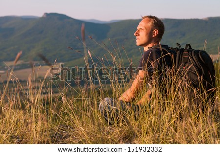 Hiking Traveler Resting In The High Grass
