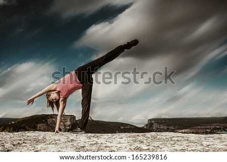 Yoga outdoor practice. Half moon yoga pose