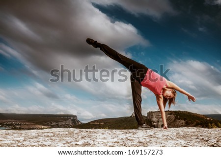 Yoga outdoor practice. Half moon yoga pose