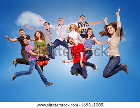 Group happy young people jumping in sky