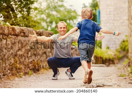 Son runs to daddy's arms