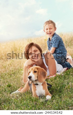 Family with dog have a calm leisure time outdoor