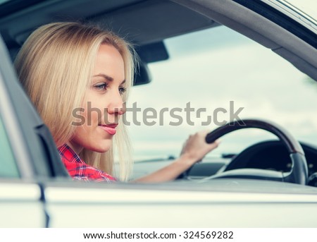 Young woman drive a car