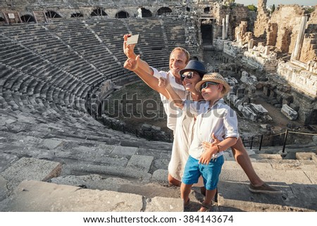 Family vacation selfie photo in antique amphitheater ruins in Side, Turkey