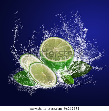 Abstract background with sliced lime in water drops