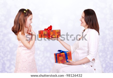 Pregnant mother prepare gifts for her daughter. Brother or sister?