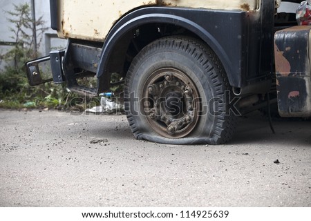 Flat tire of an abandoned truck in Moscow Russia.