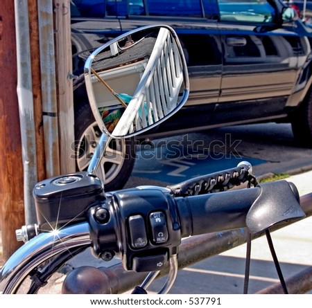 Reflection in a mirror on motor cycle handle bars.