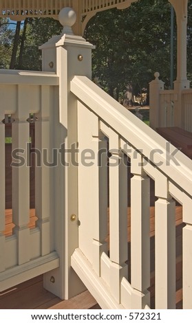 Stair railing of a gazebo in a park.