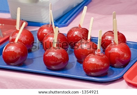 Candied apples at a food stand on 9th Ave in New York City during a food festival.