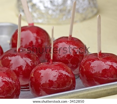 Red candied apples on a stick at a street fair in New York City.