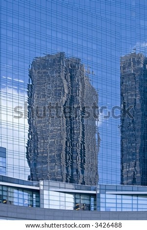 Reflection of buildings on the glass facade of one of the Time Warner towers at Columbus Circle in New York City.