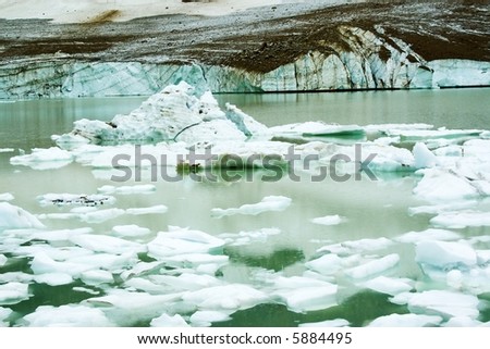 Glacial pool with large chunks of melting ice near Jasper Alberta Canada.