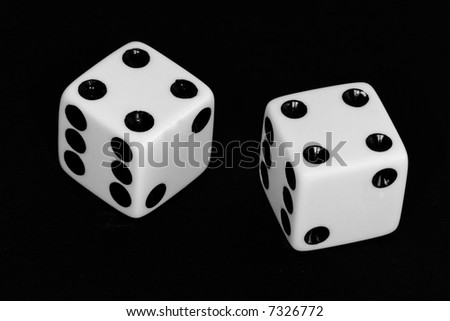 Black and white image of a pair of dice thrown with the number eight.