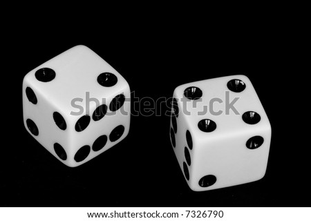 Black and white image of a pair of dice thrown with the number six