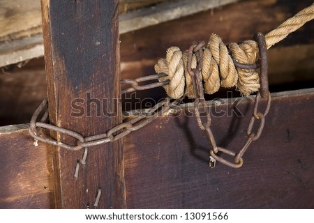 Rope knot and chain in a historical grinding mill along Old Mill creek near Marlinton West Virginia.