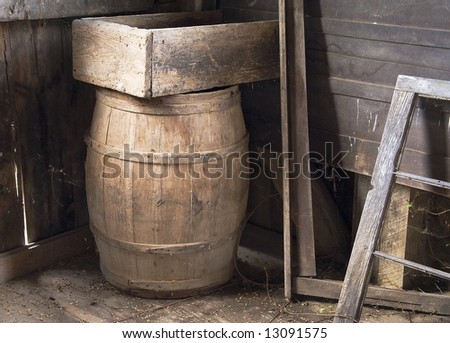 Old wooden box and barrel in the corner of a room in the historic grinding mill on Mill Creek near Marlinton West Virginia.