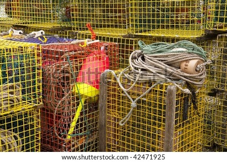 Lobster traps piled up on a dock in Bar Harbor Maine.