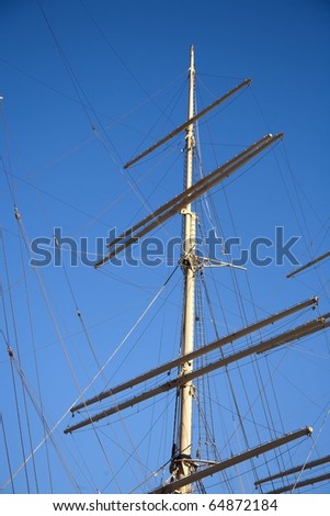 Mast on an old squared rigged sailing ship.