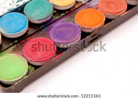 Various colors for painting in a water color box on white background